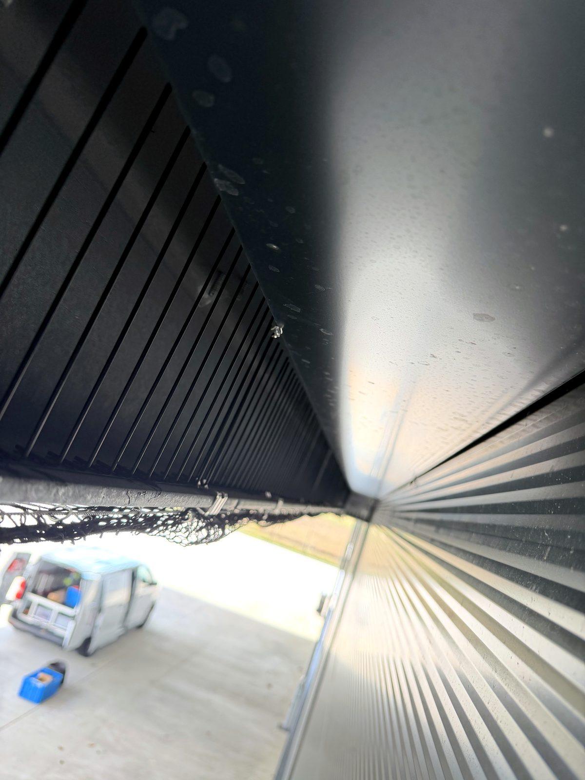 Pigeon deterrent spikes on a beam end of a logistics hall